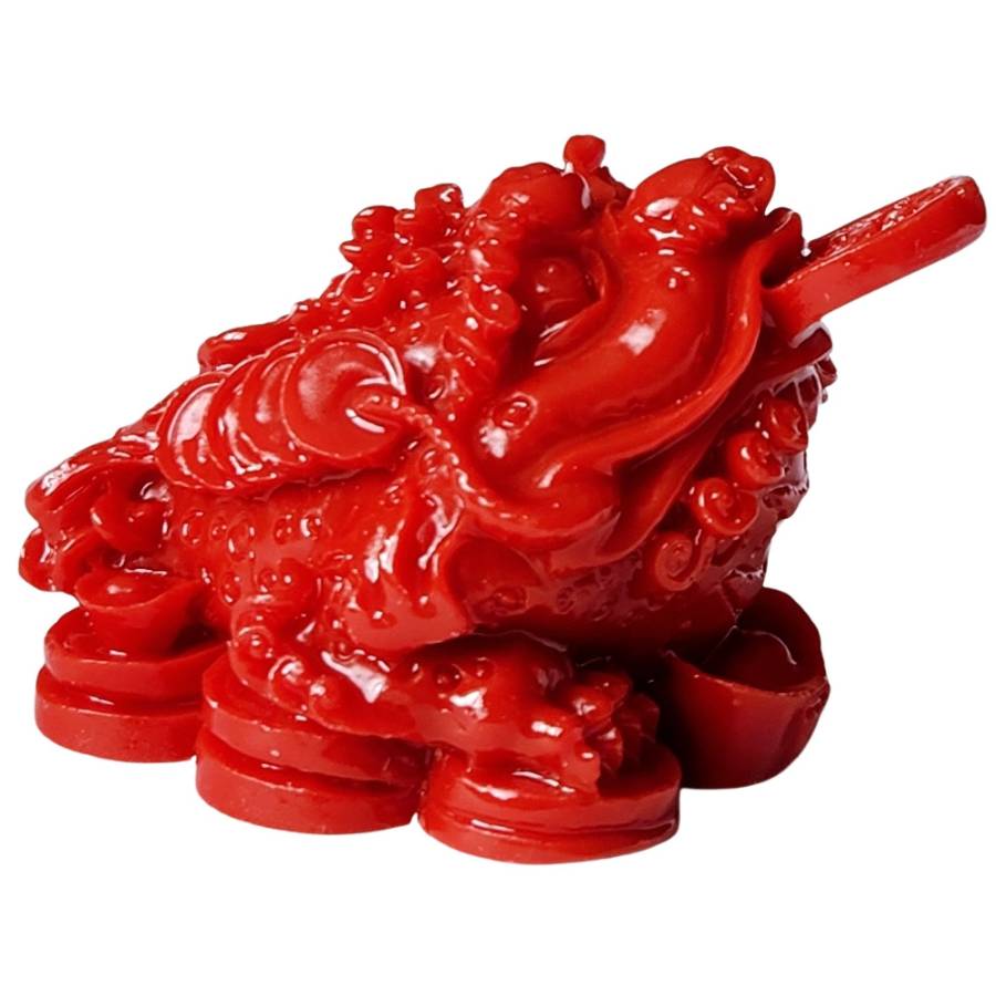 Grenouille Feng Shui rouge assise sur pièces