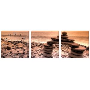 Horloge Murale Galets sur la Plage Feng Shui avec cairns face à l'océan
