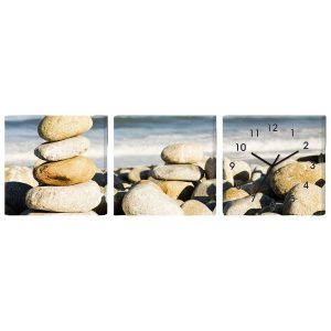 Horloge Murale Galets Totem Feng Shui avec cairn sur une plage