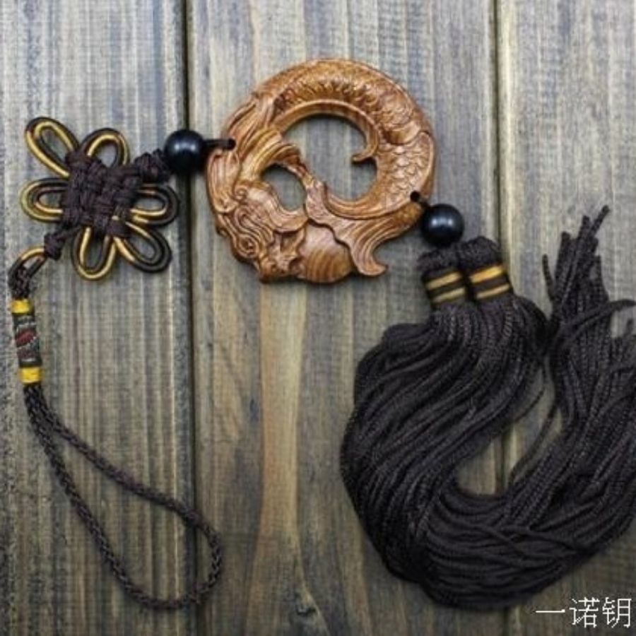 Détail dragon Feng Shui sculpté en bois naturel