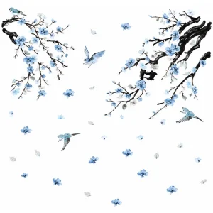 Sticker mural branches de cerisier aux fleurs bleues avec petits oiseaux en vol et pétales dispersés